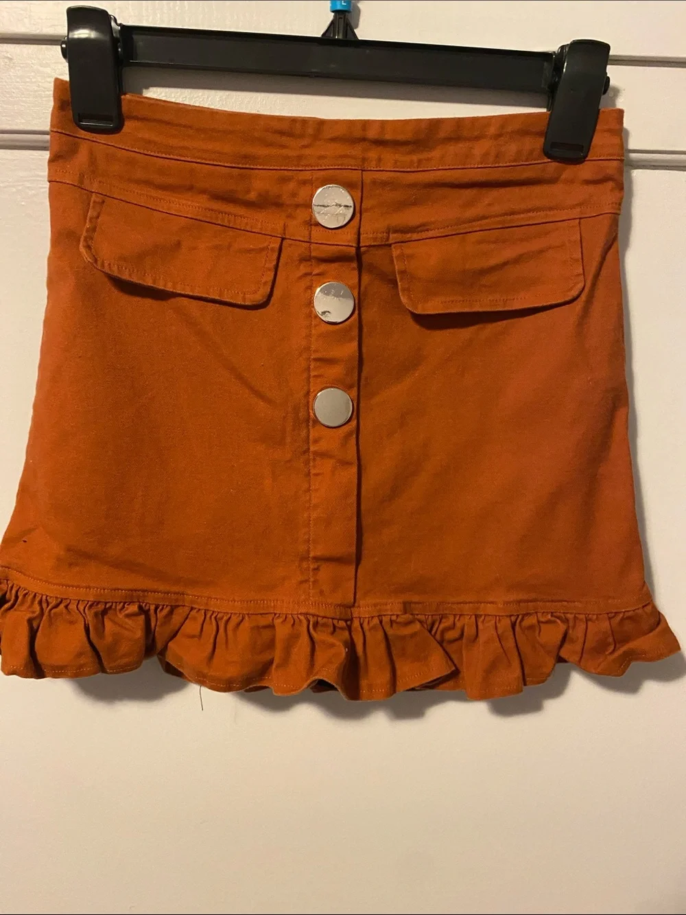 Pink Lily Rust Button-Front Ruffle Hem Mini Skirt with shorts liner/slip